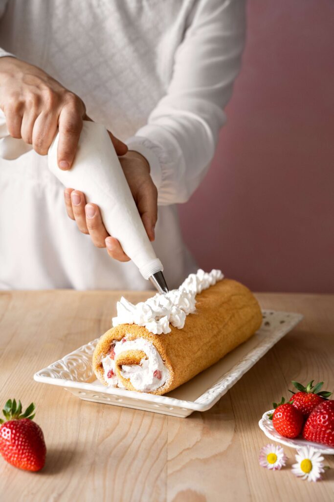 tasty-cake-with-whipped-cream-table-high-angle (1)